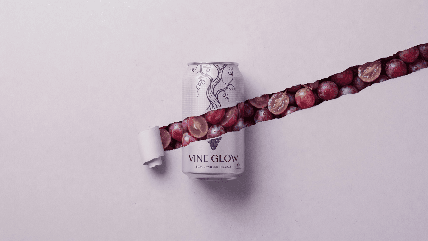Vine Glow grape drink can on a torn-paper background