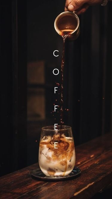 Espresso poured over an iced milk glass