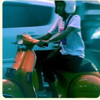 Quick commerce delivery rider on a scooter
